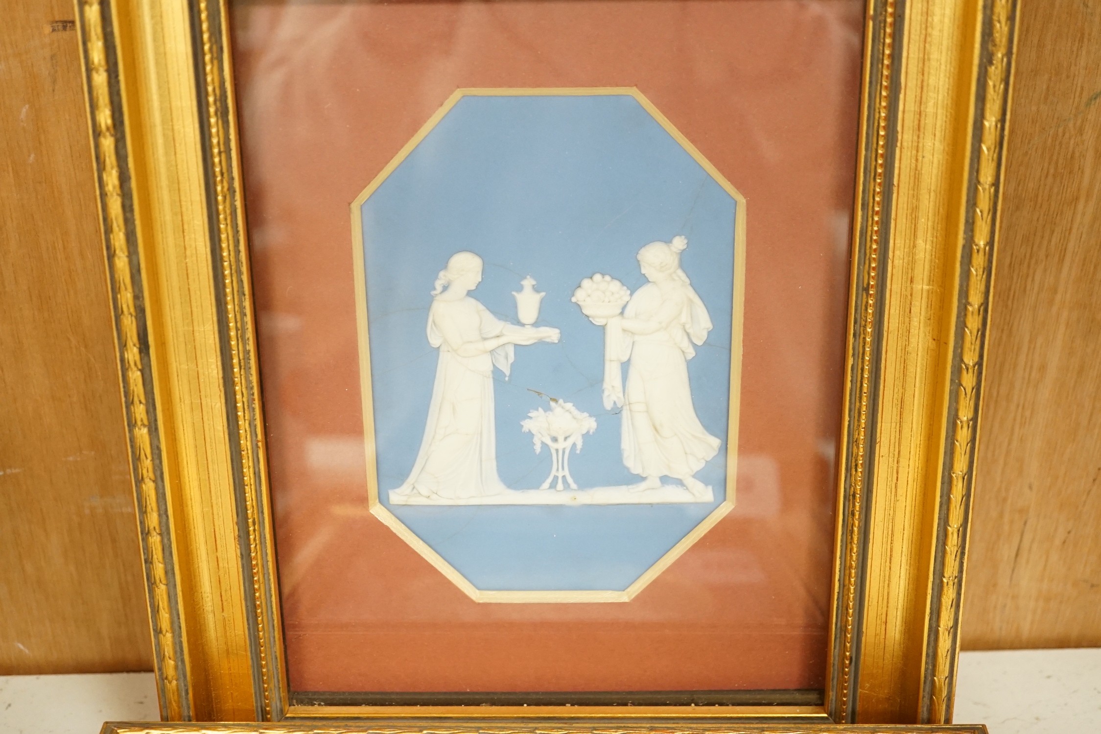 Three framed Wedgwood Jasper ware plaques (one cracked), largest 14.5cms high